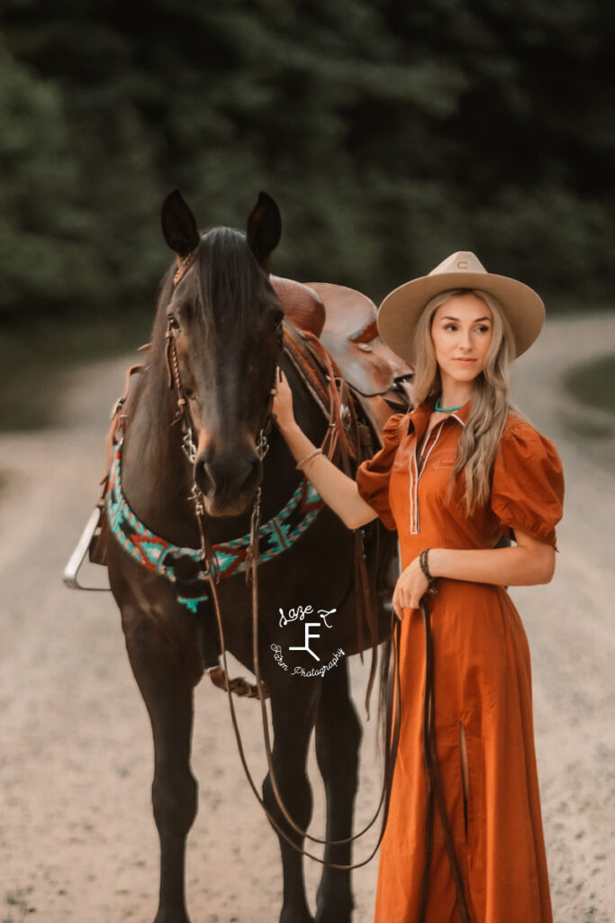 cowgirl loving on palomino in floral dress