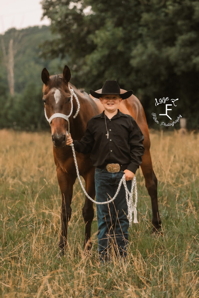 brother with his bay horse