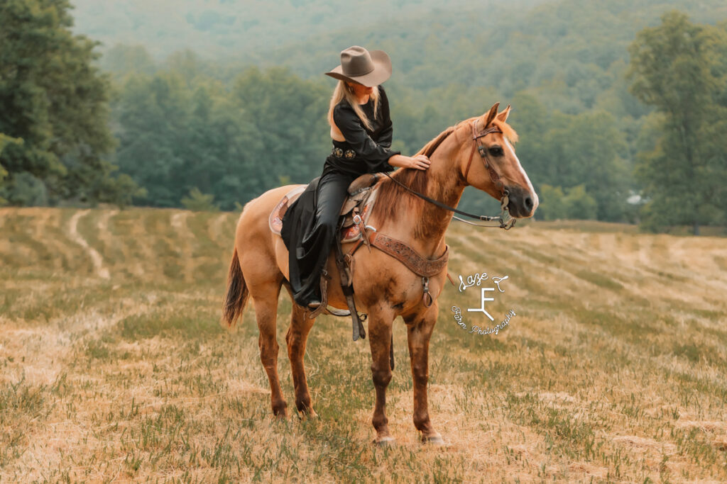 cowgirl in a black dress on dunn horse
