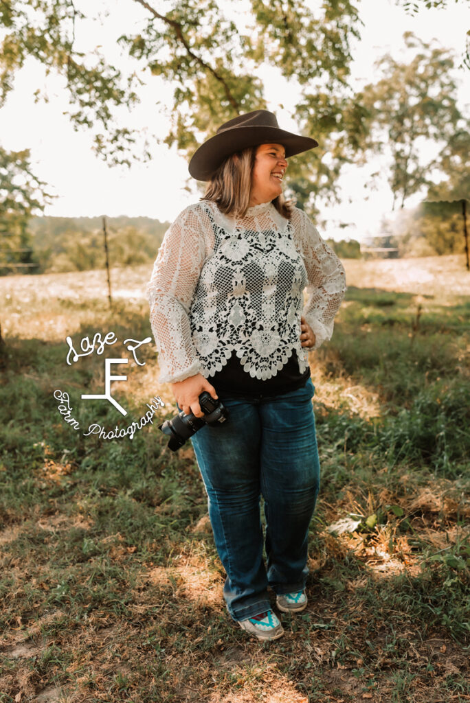 cowgirl photographer in lace shirt