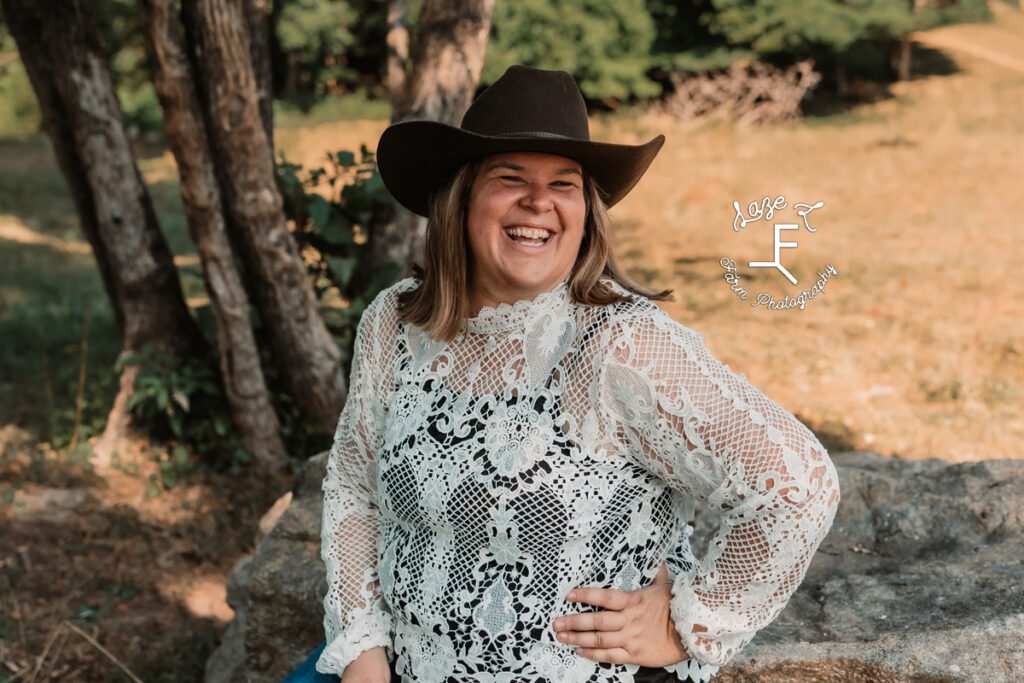 cowgirl in lace shirt laughing