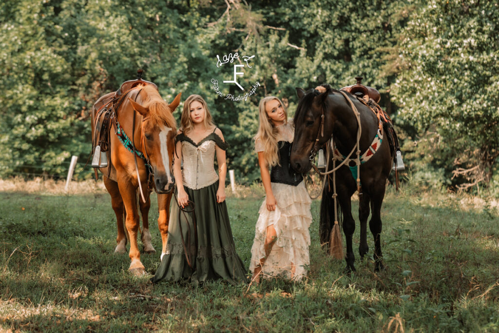 2 models with 2 horses in vintage dresses