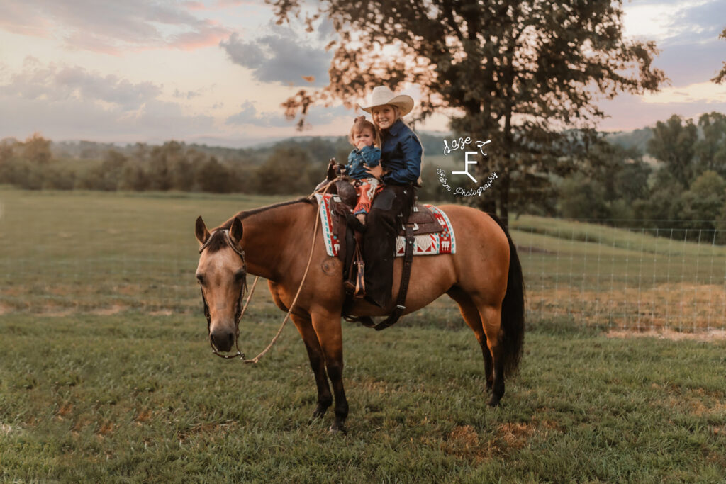 both little cowgirls on horseback