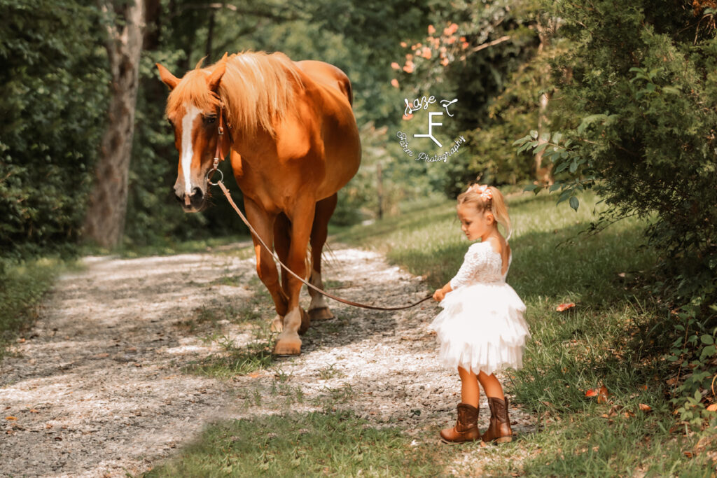 little cowgirl with horse
