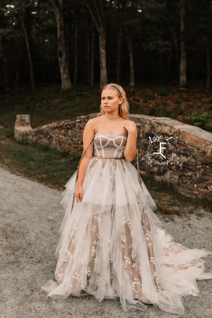 model looking left at stone wall