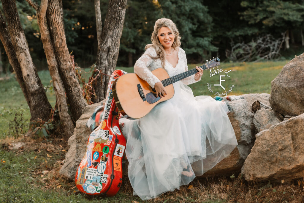 Bambi holding guitar and smiling at camera