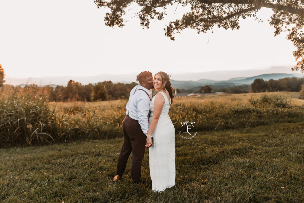 bride and groom with mountains in the background