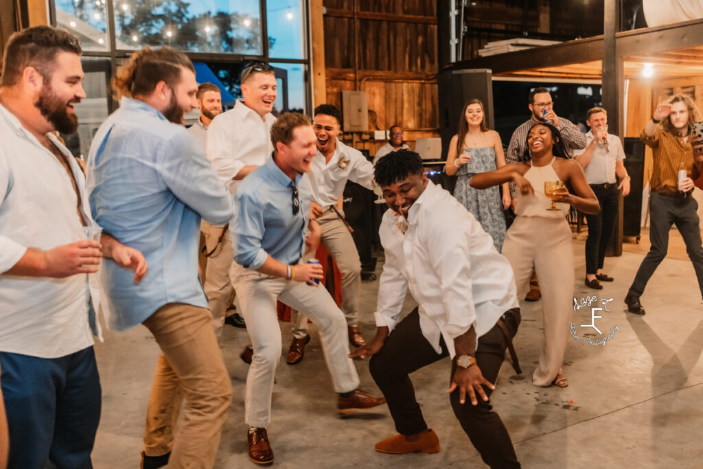 groom dancing with his friends