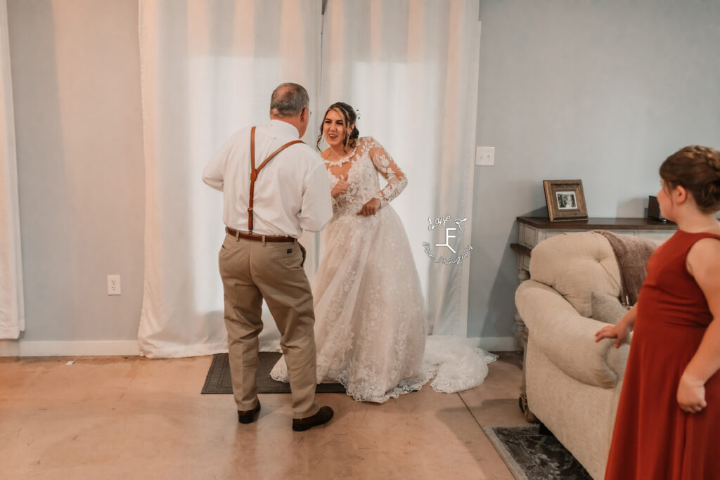 bride with grandpa dancing before wedding