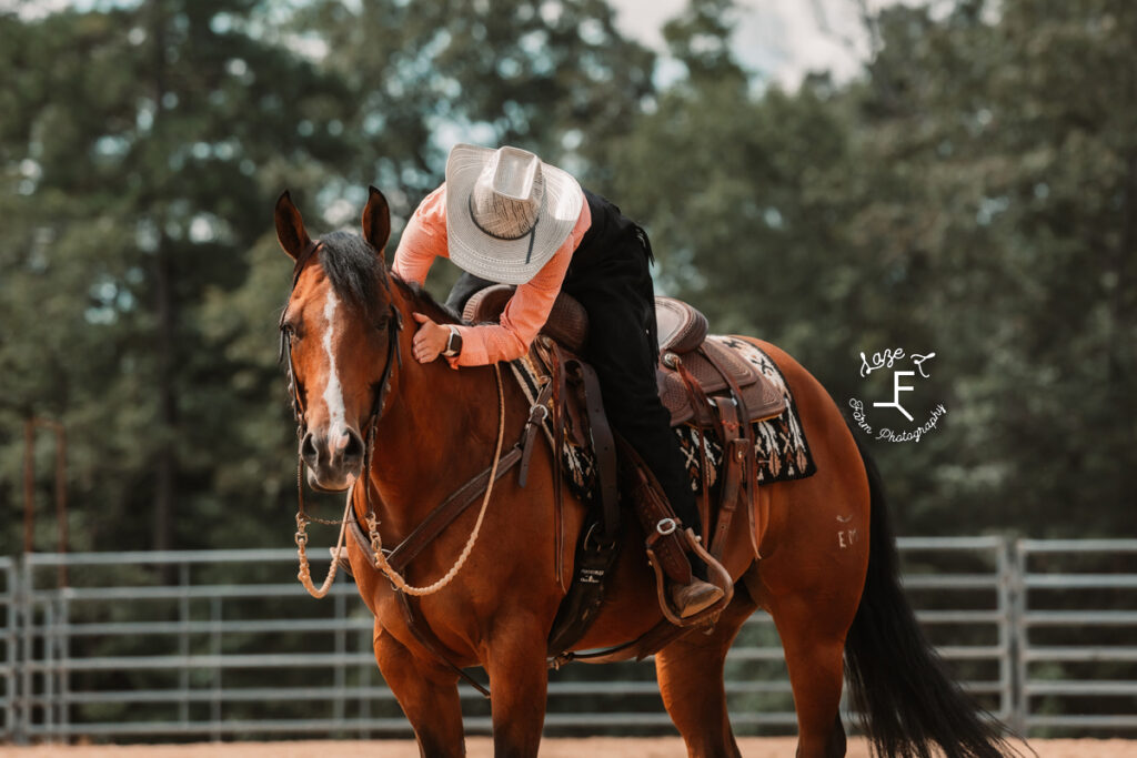 cowgirl on her bay mare