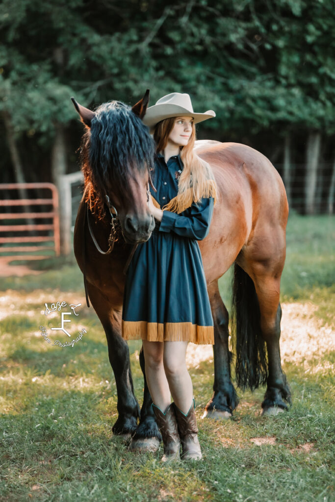 cowgirl with shire cross in vintage dress