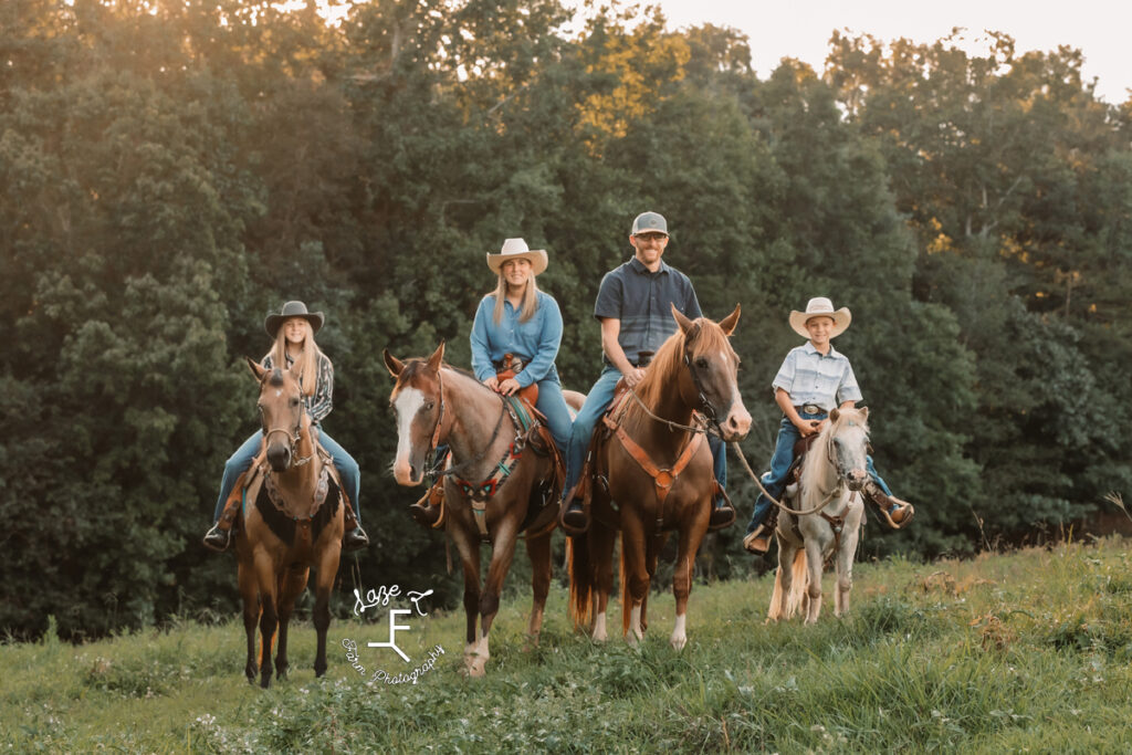 family of 4 on horse back