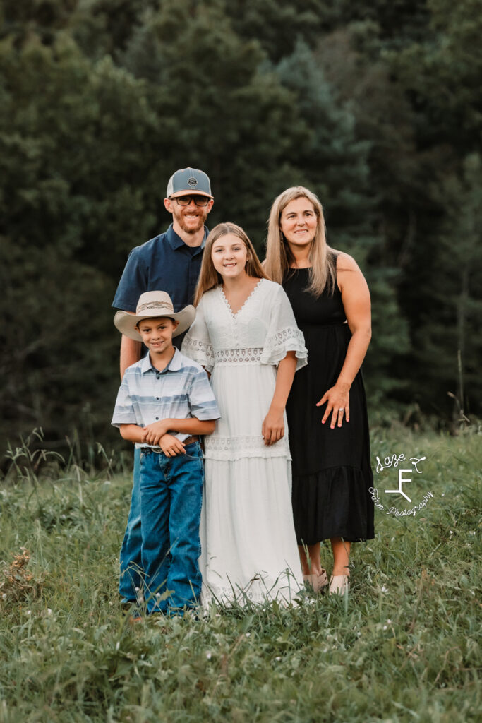 family of 4 in a field