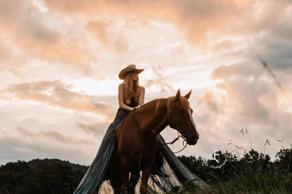 cowgirl at sunset in parachute dress on horseback