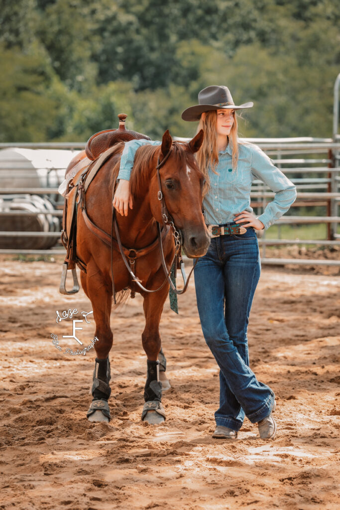 redhead cowgirl with her horse