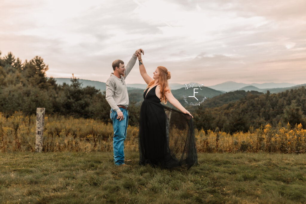 couple dancing with mountains in the background