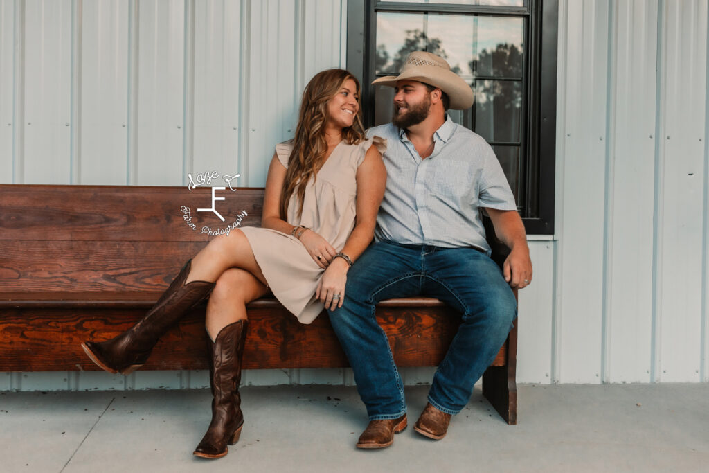 husband and wife sitting on church pew 