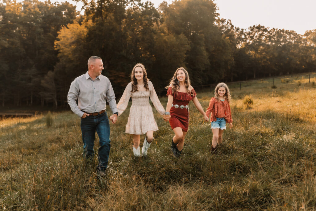 western family walking in field