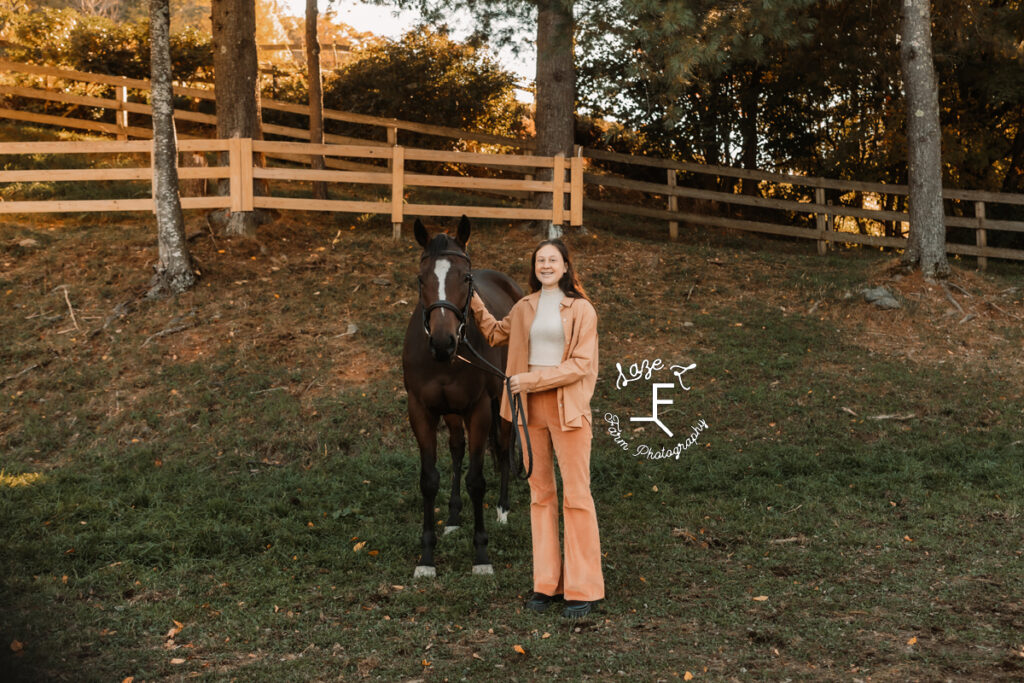 sister in orange with horse