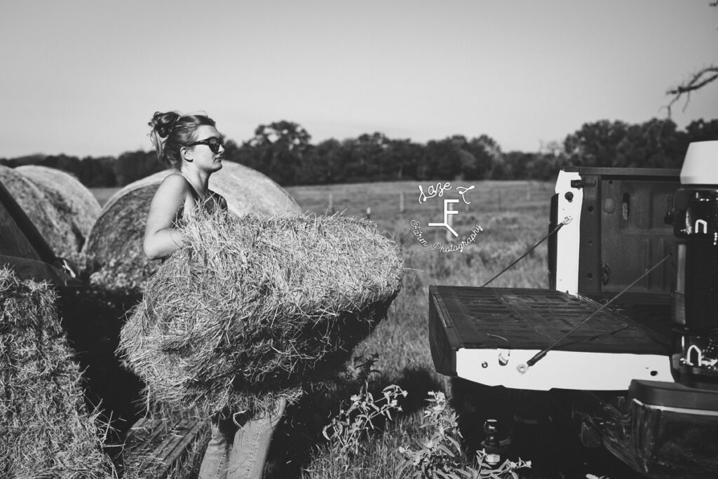 throwing hay in black and white