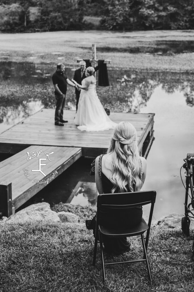 daughter watching wedding in black and white