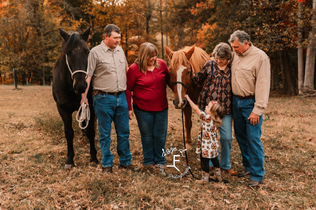 mom, dad, daughter, grandparents and horses