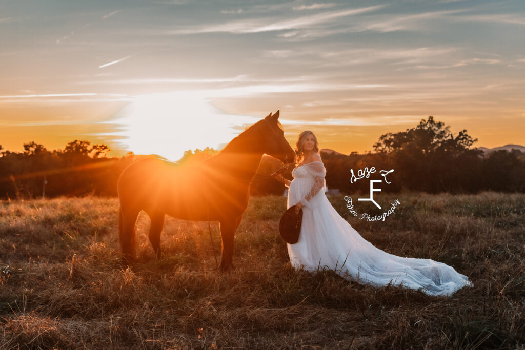 mama with horse in white dress at sunset