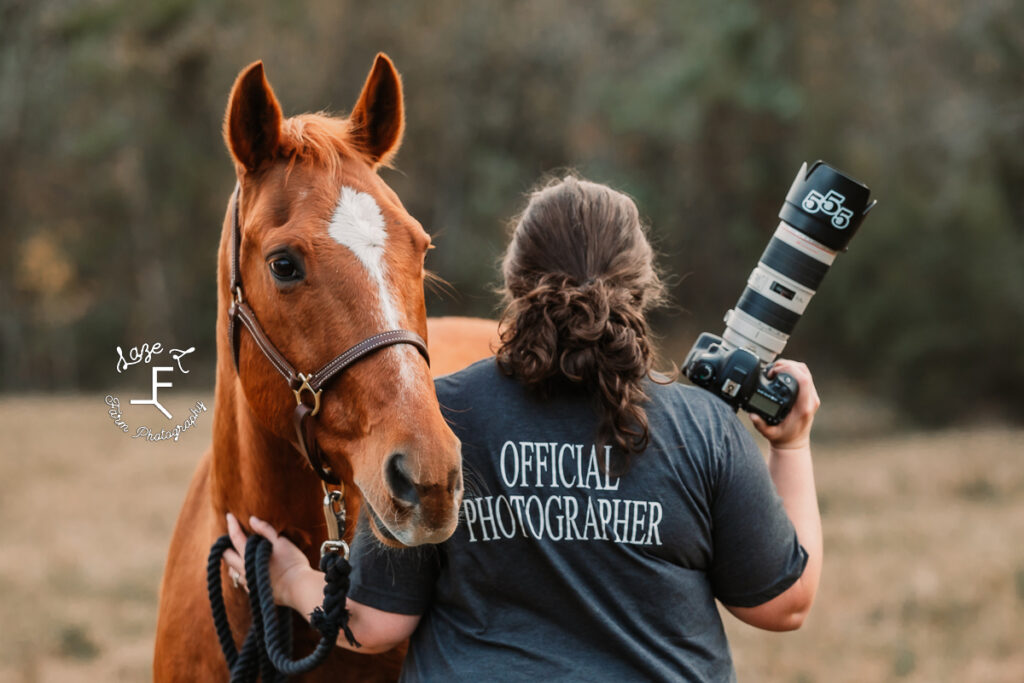 heather holding her camera with her horse
