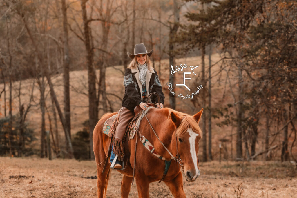 Cowgirl riding red horse