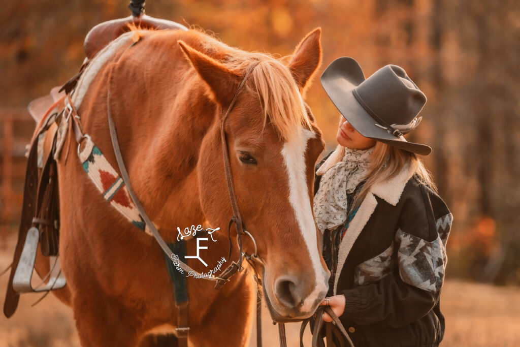 Cowgirl loving big red horse