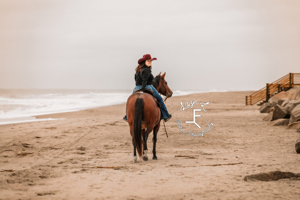 cowgirl riding away and looking back