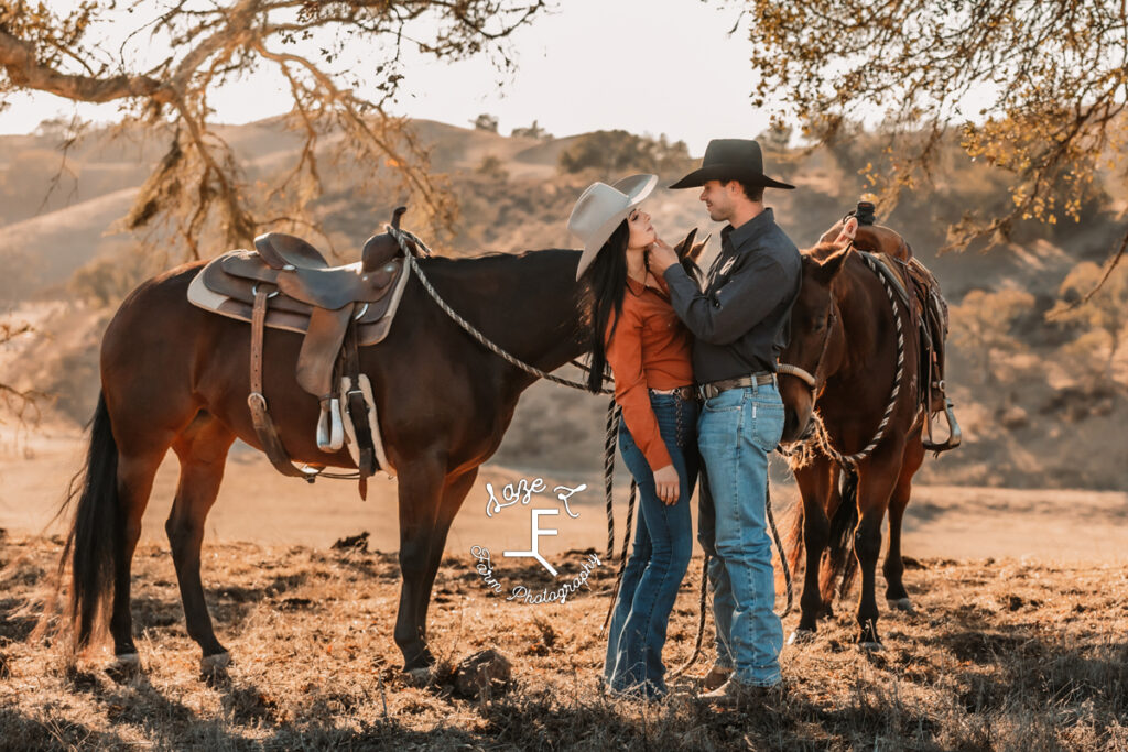 western couple with their horses looking at each other