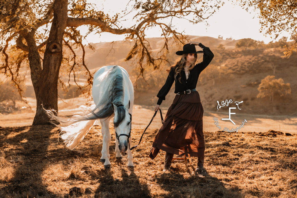 cowgirl in black with white Andalusian