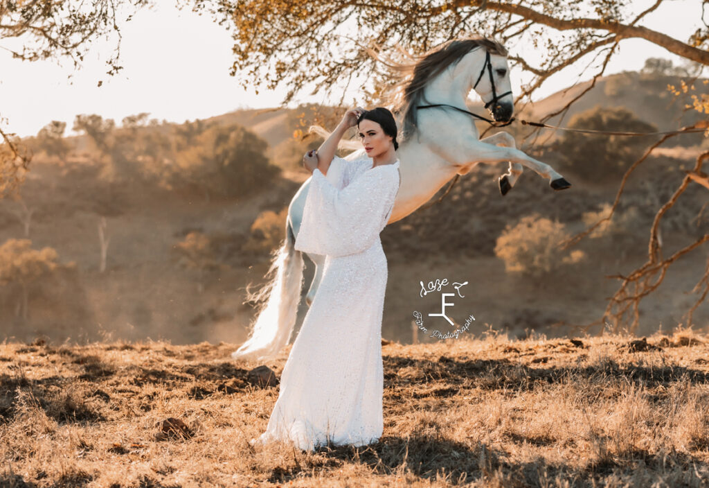 Bride model with Andalusian in the background rearing