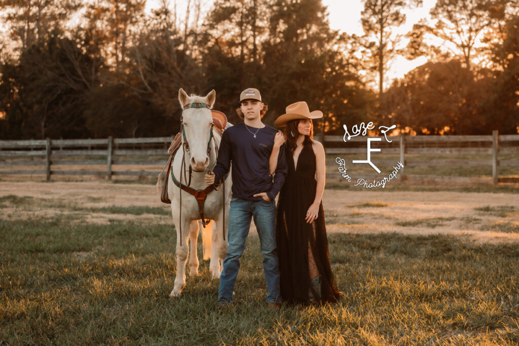 Cowgirl in dress with boyfriend and horse