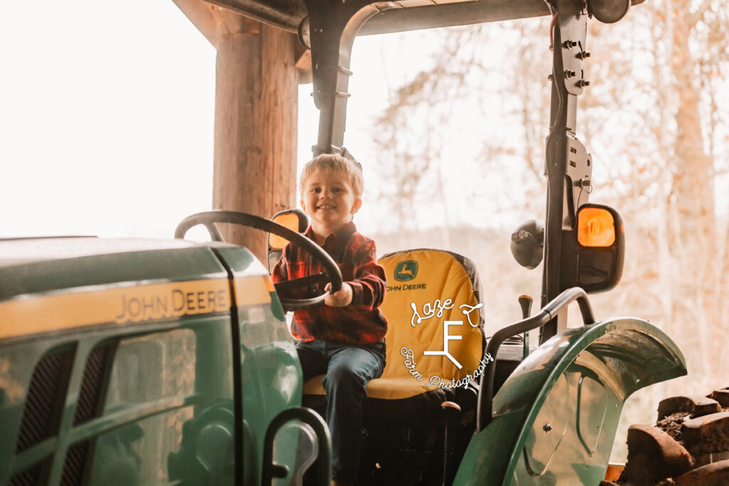 Little brother on tractor