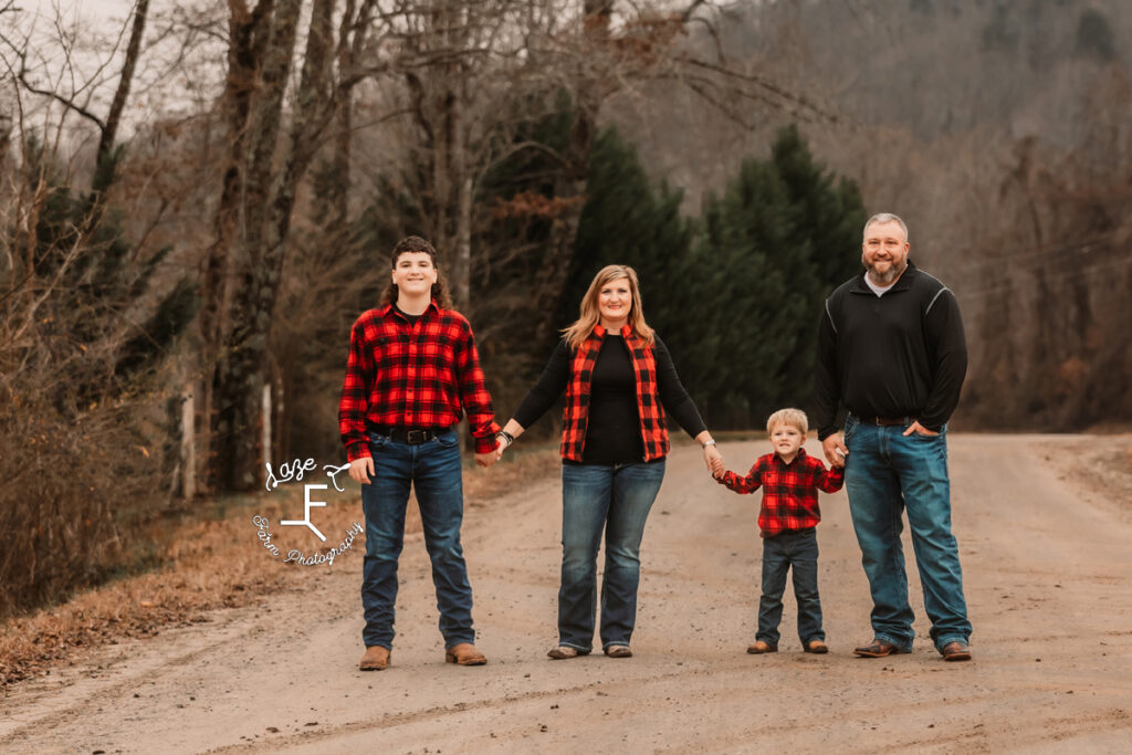 Childers family on the dirt road holding hands