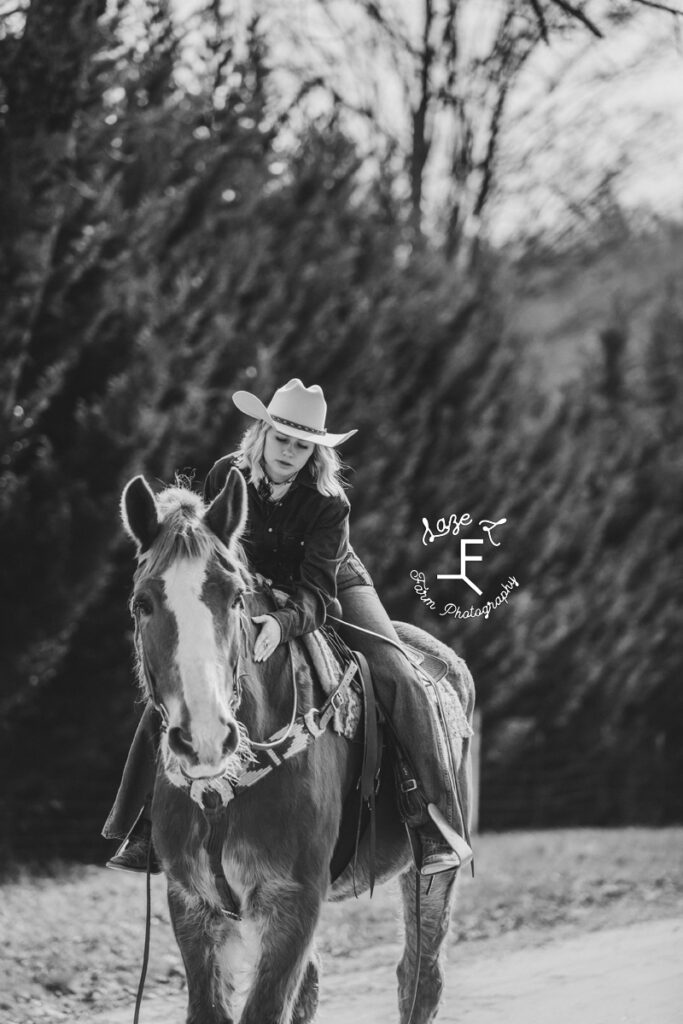 Reid riding Dolly in black and white