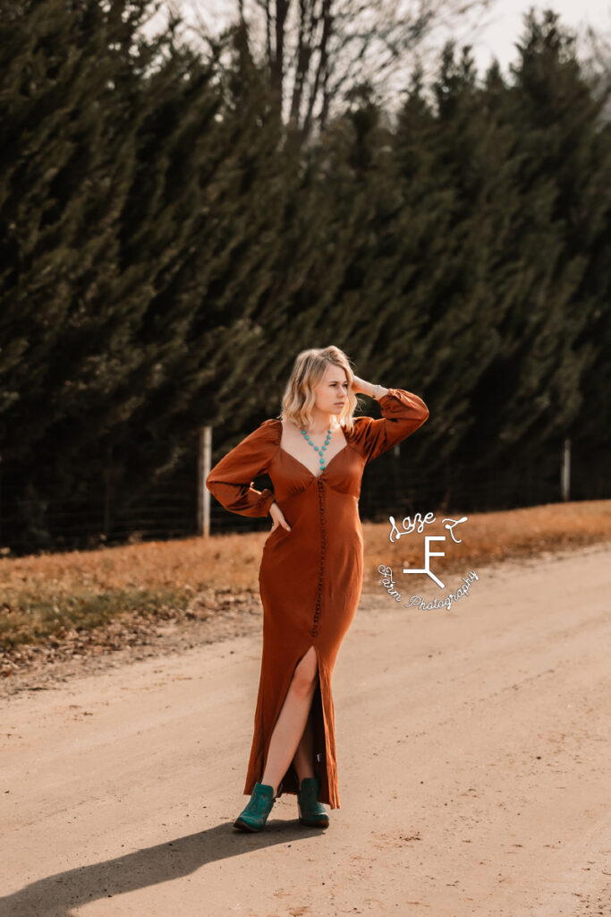 Reid in burnt orange dress with turquoise boots