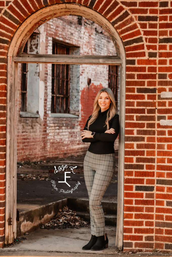 Sam leaning in old window frame