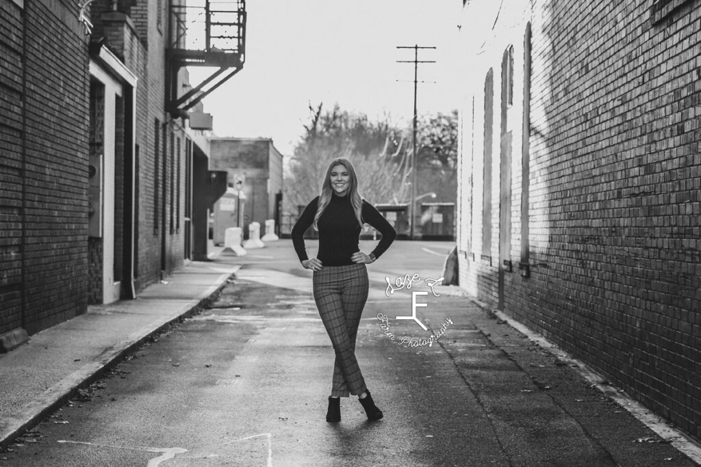 Sam in alleyway in black and white