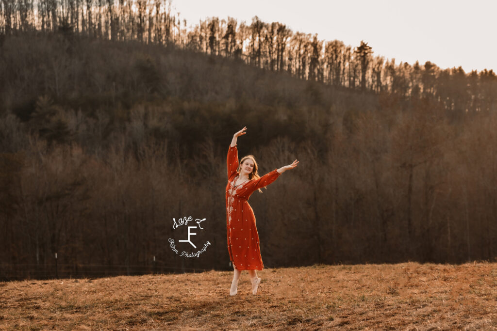 Amelia in orange dress dancing