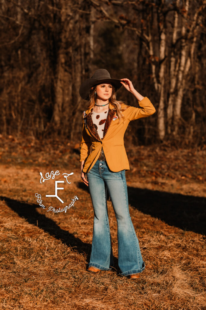 model in mustard blazer jacket looking right