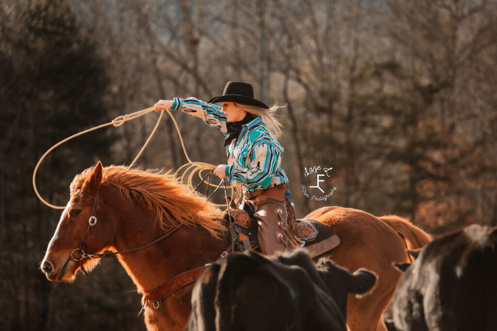 Maria riding Gus throwing a rope 