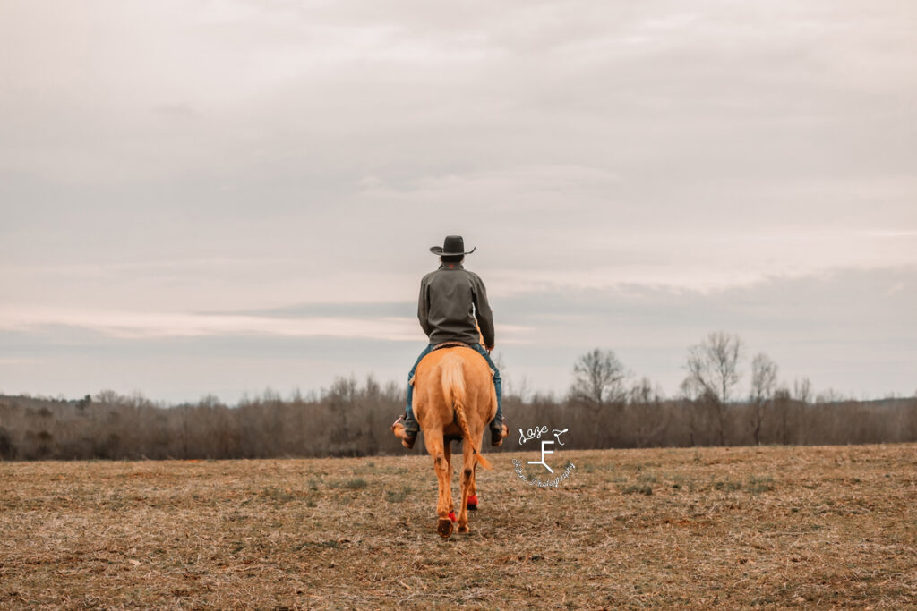 cowboy riding away