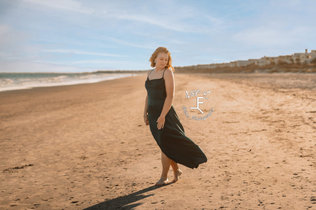 Kayla on the beach in green dress