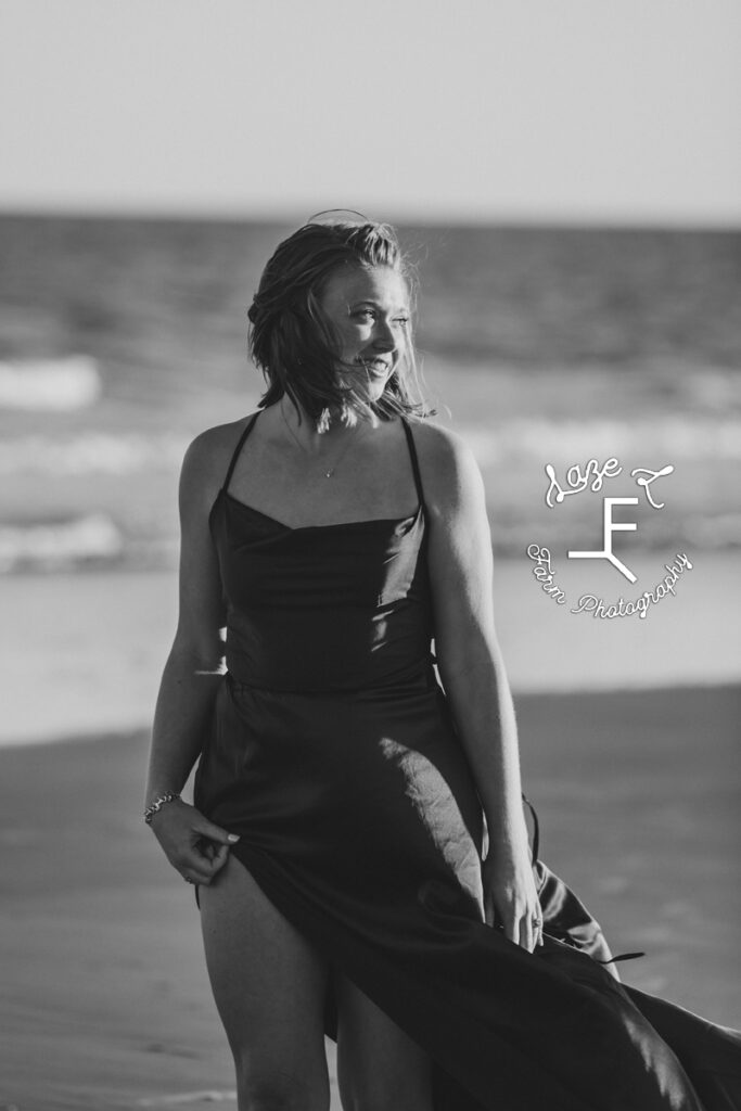 Kayla in front of the ocean in black and white