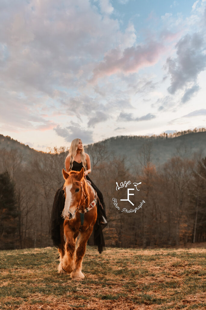 Miranda riding Dolly in long black dress