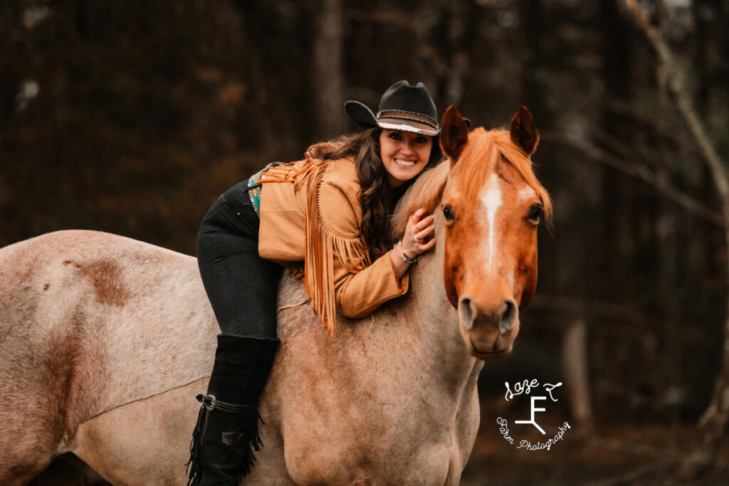 Amy sitting with red roan