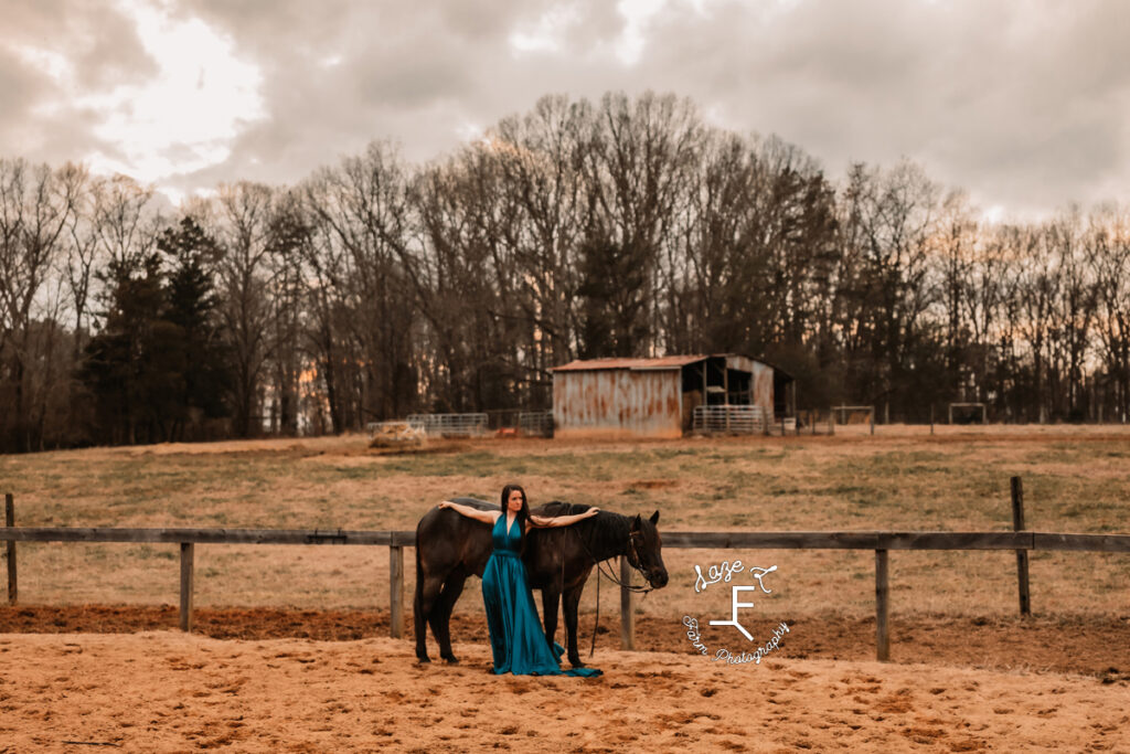 Danielle standing with Chex in turquoise dress